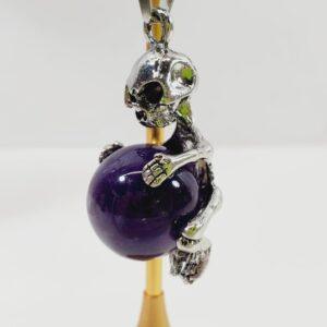 Unique Skeleton Hugging an Amethyst Ball Pendant